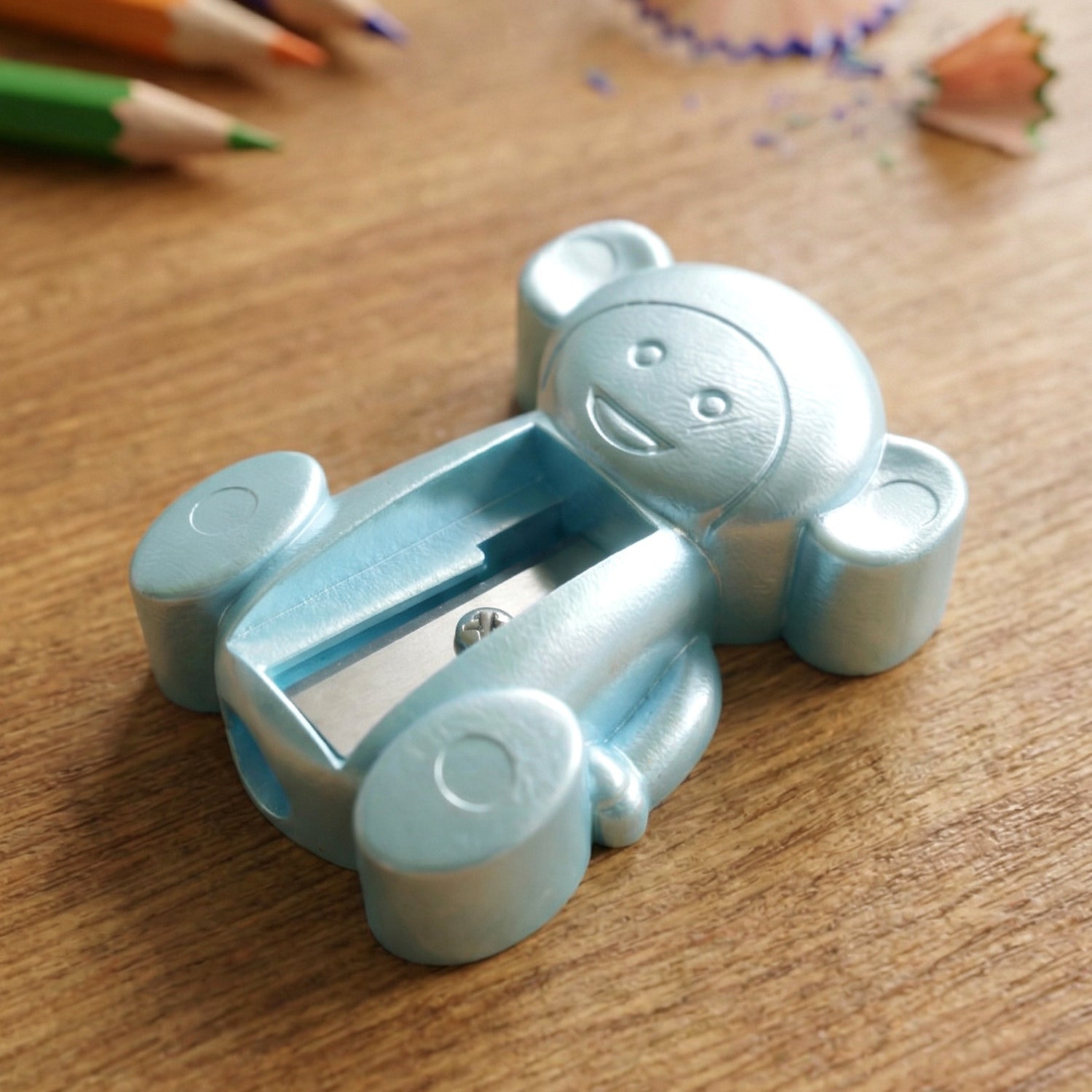 Close-up view of manual pencil sharpener with monkey shape