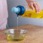 Versatile oil dispenser bottle used for cooking, baking, and dressing salads with precision.