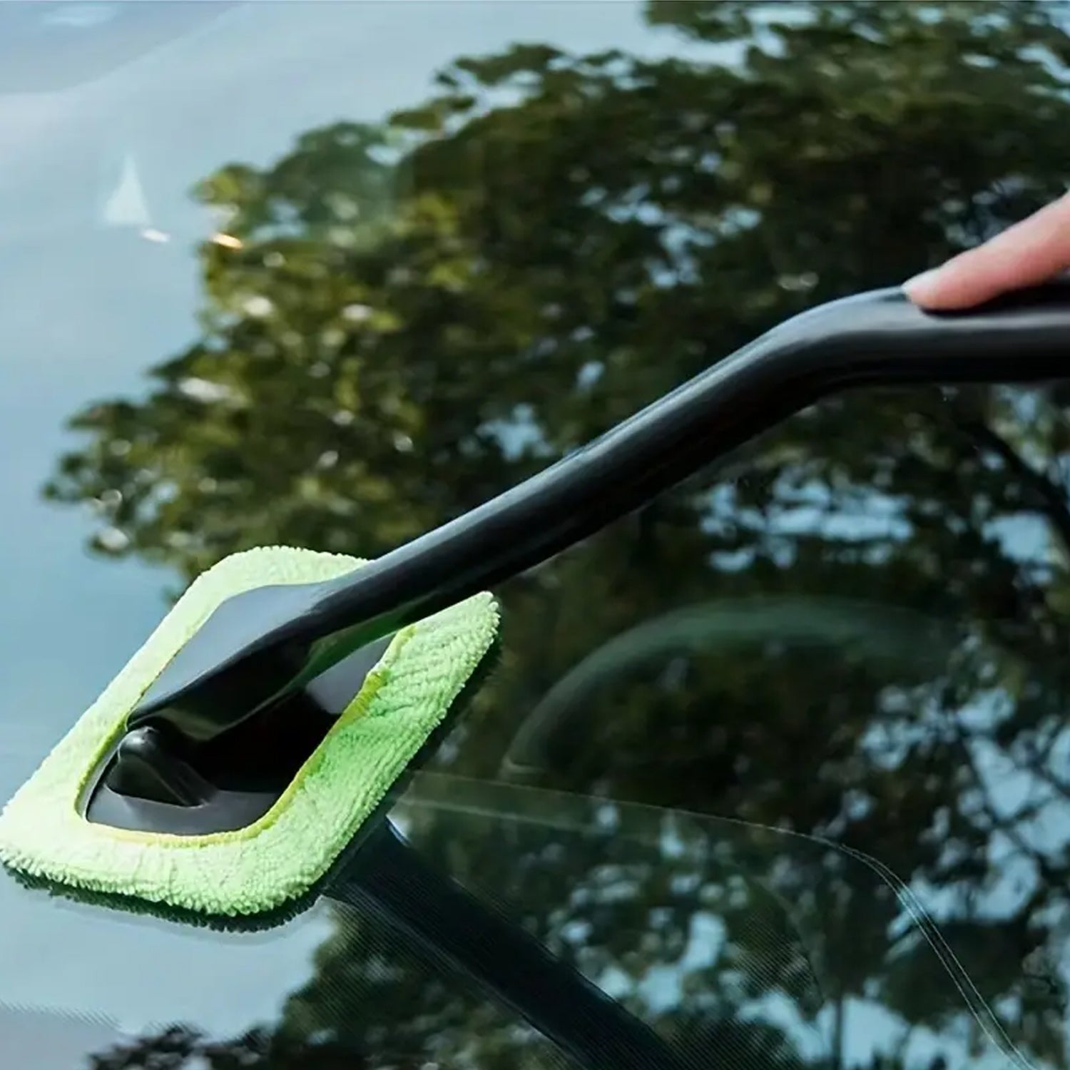 Microfiber cleaner wiper displayed with other car detailing accessories.
