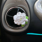Top view of floral rose air freshener clip designed for car AC vents