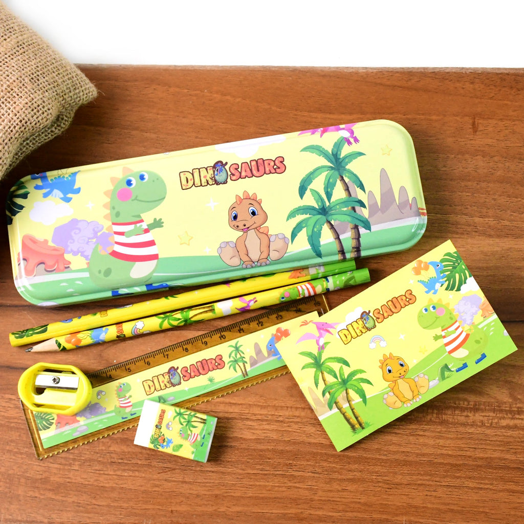 Kids stationery set components laid out showing dinosaur-themed pencils and ruler