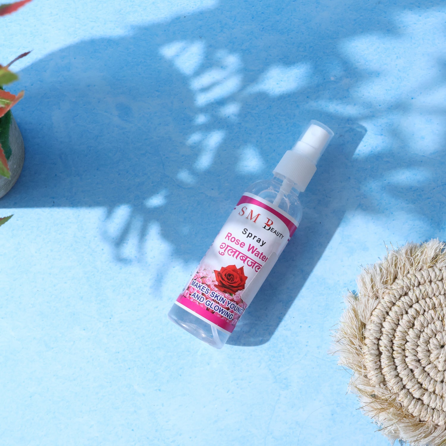 Transparent spray bottle of rose water toner for daily skin hydration