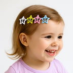 Star shape metal hair clip resting on wooden surface