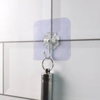 Comparison showing heavy duty adhesive wall hooks next to similar products