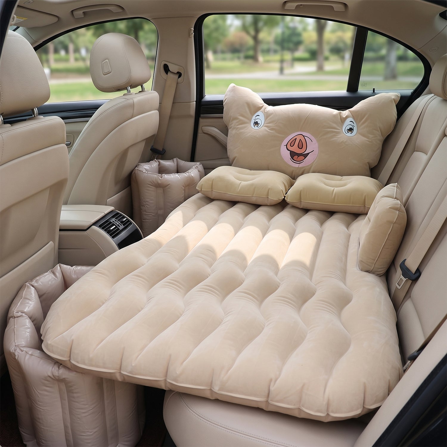 Inflatable car mattress installed in sedan back seat for travel