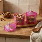 Set of transparent plastic dry fruit storage jars with decorative lids
