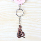 Metal Bal Krishna keychain attached to a set of keys