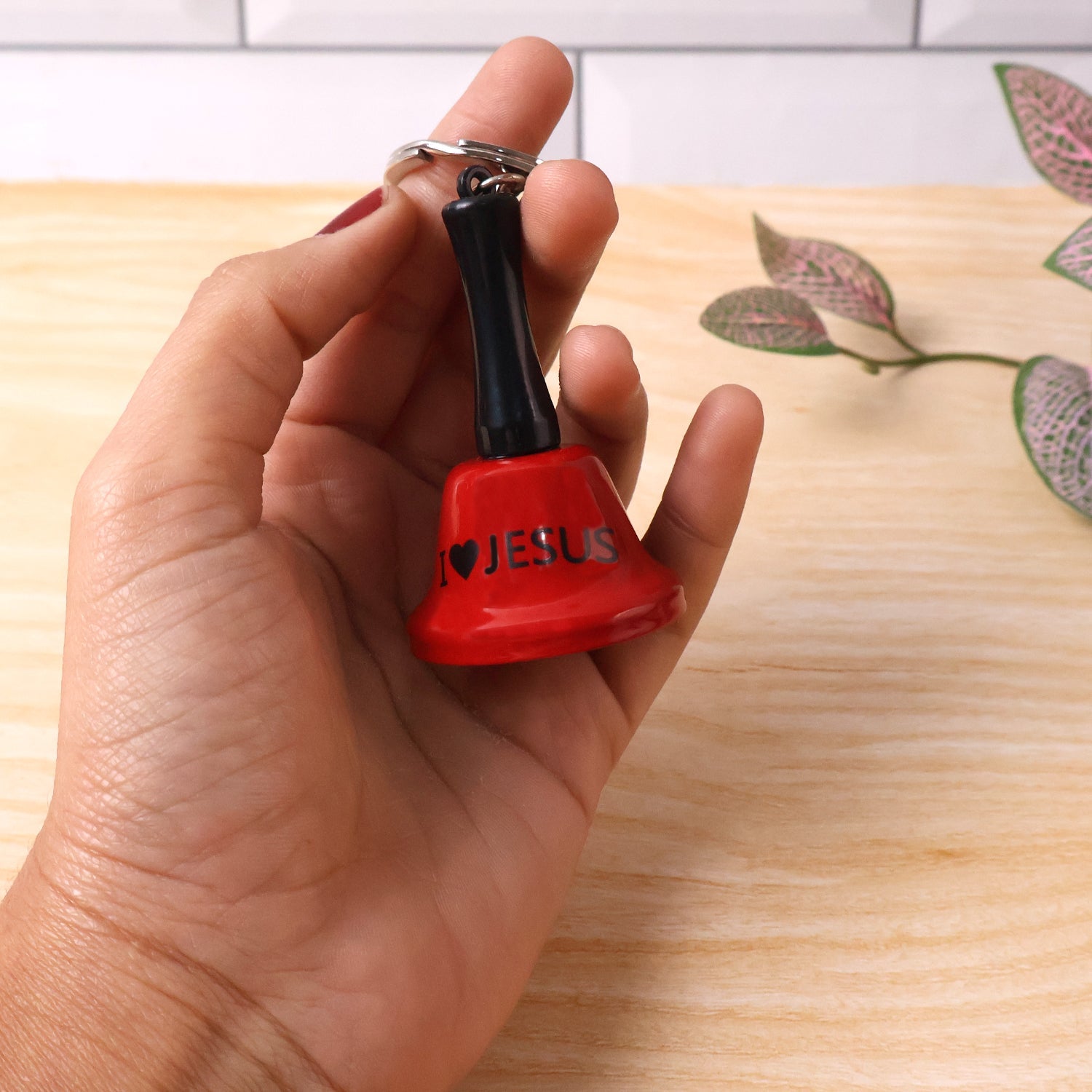 Mini 'Ring for Wine' hand bell keychain in glossy red finish