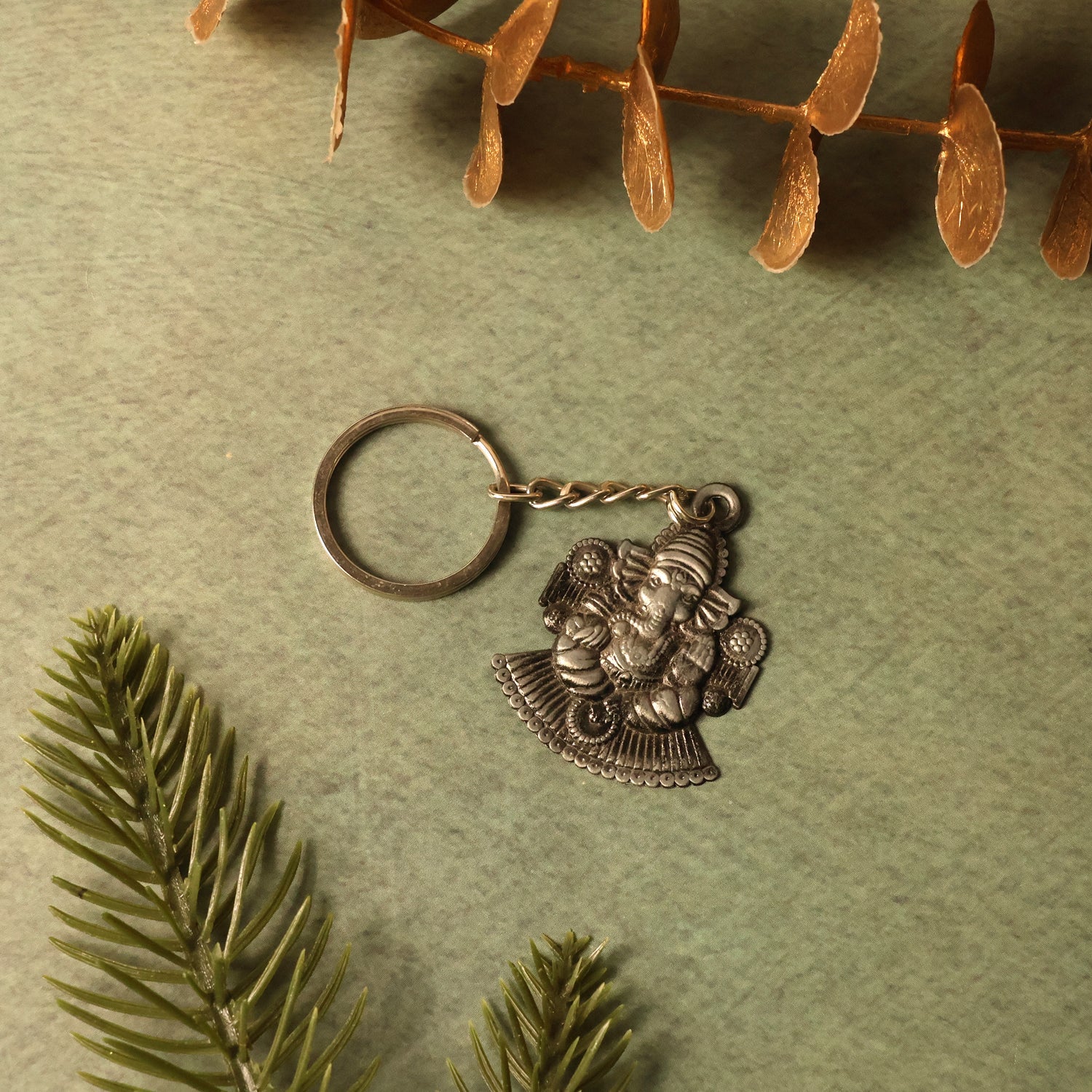 Side view of Lord Ganesha silver metal keychain
