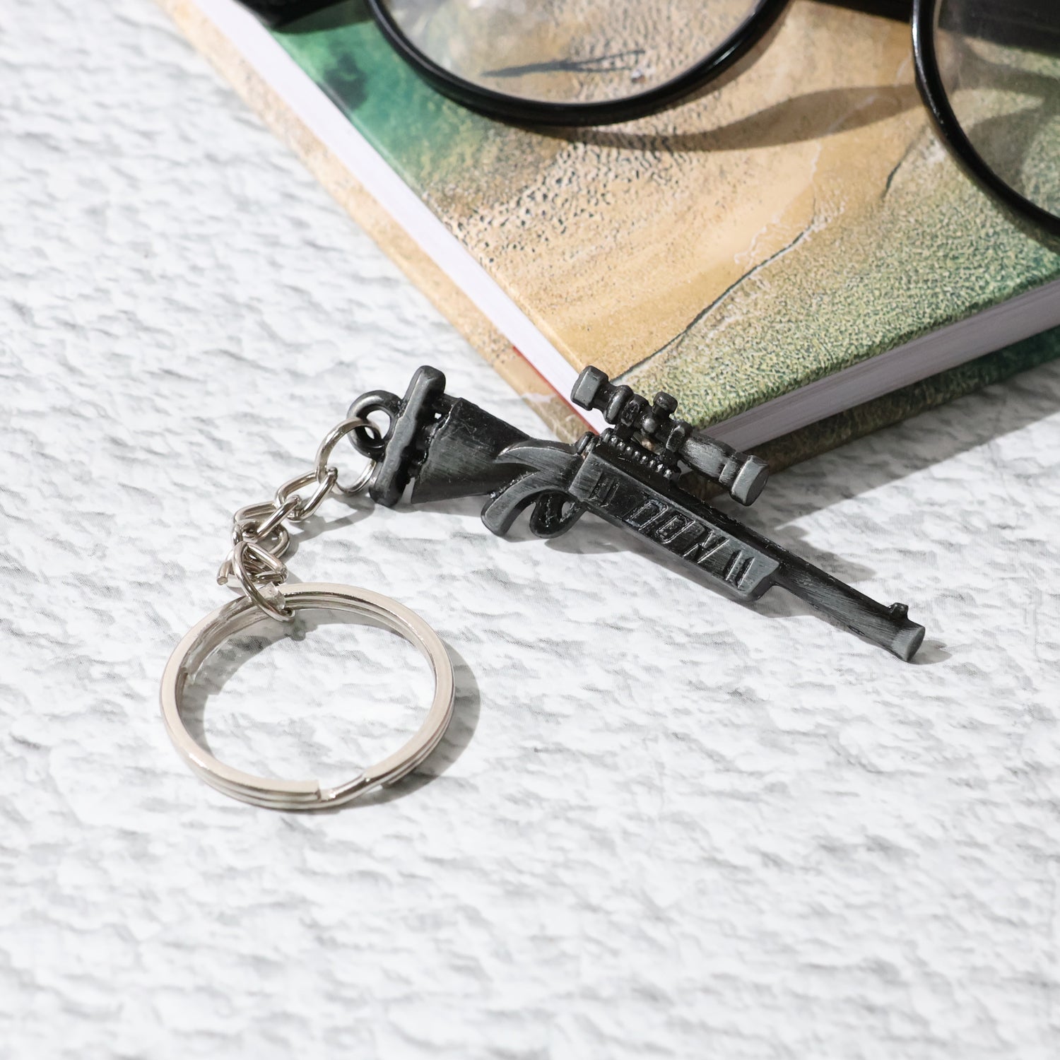 Stylish weapon-inspired metal keychain suitable for car and bike keys