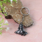 Metal keychain displaying detailed Shiva face and metal attachments
