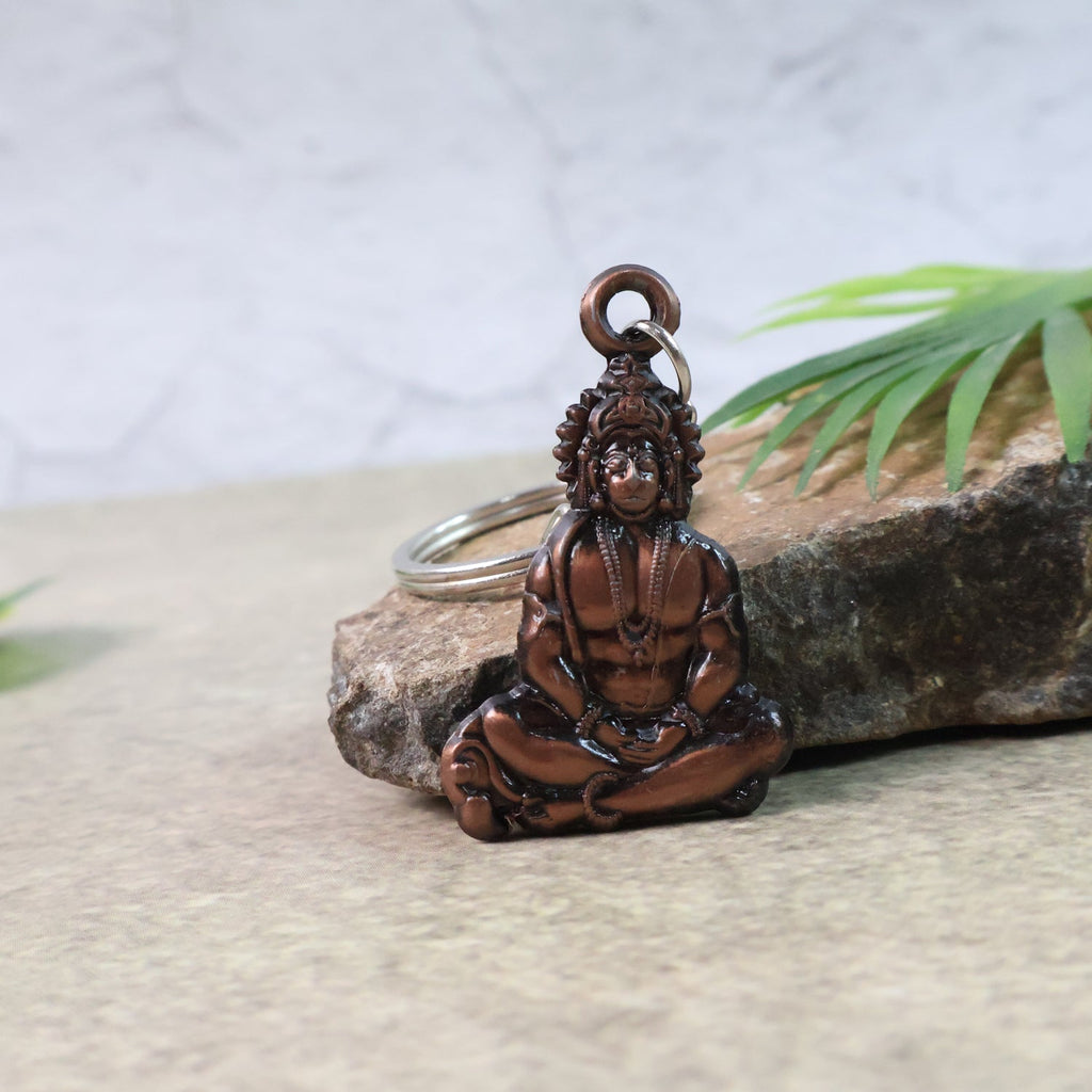 Detailed view of a Hanuman keychain made from metal with intricate design