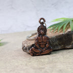 Detailed view of a Hanuman keychain made from metal with intricate design