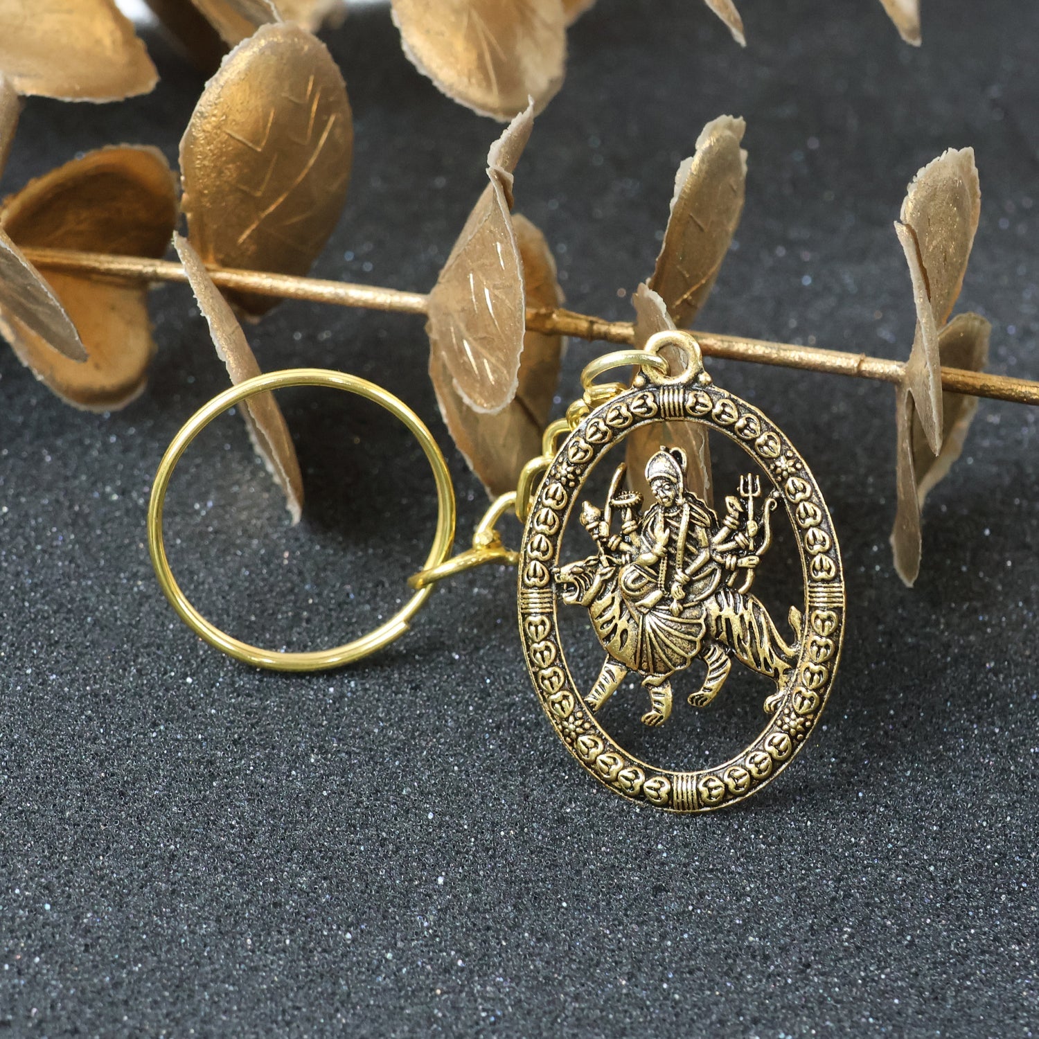 Close-up of Maa Durga Golden Keychain highlighting intricate metalwork