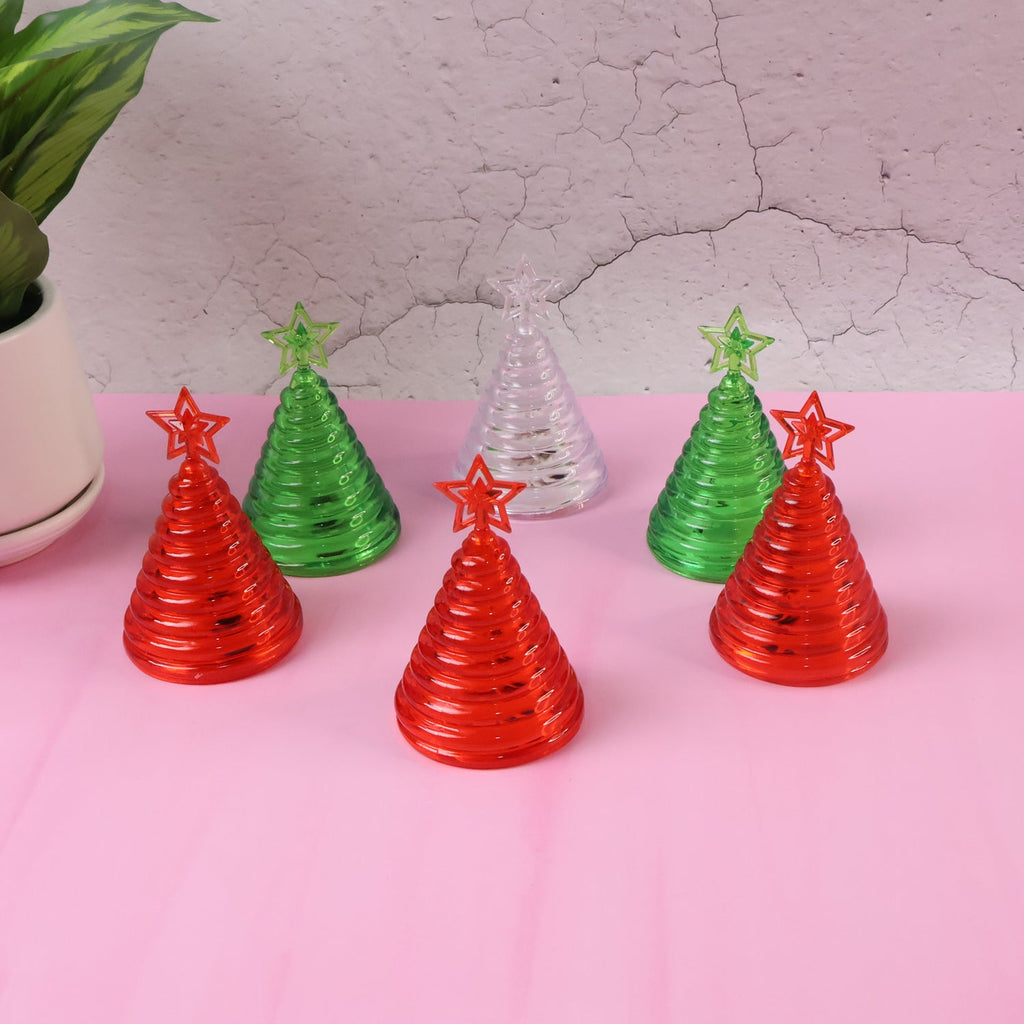 Set of mini LED Christmas tree lights glowing red, green, and white indoors