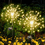 Warm white solar LED garden stake lights enhancing outdoor ambiance
