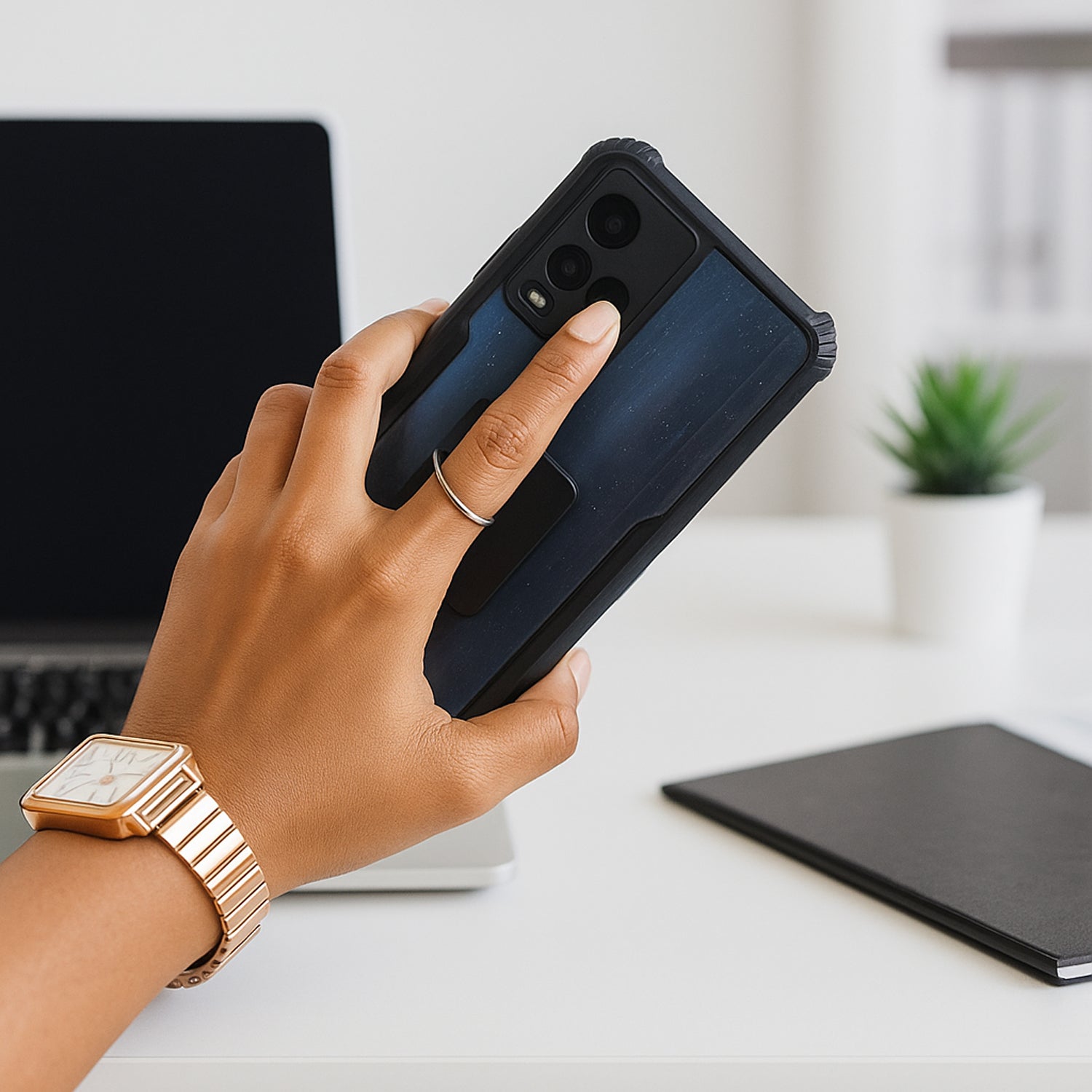 Phone ring stand fully extended, securely holding a smartphone for hands-free viewing.