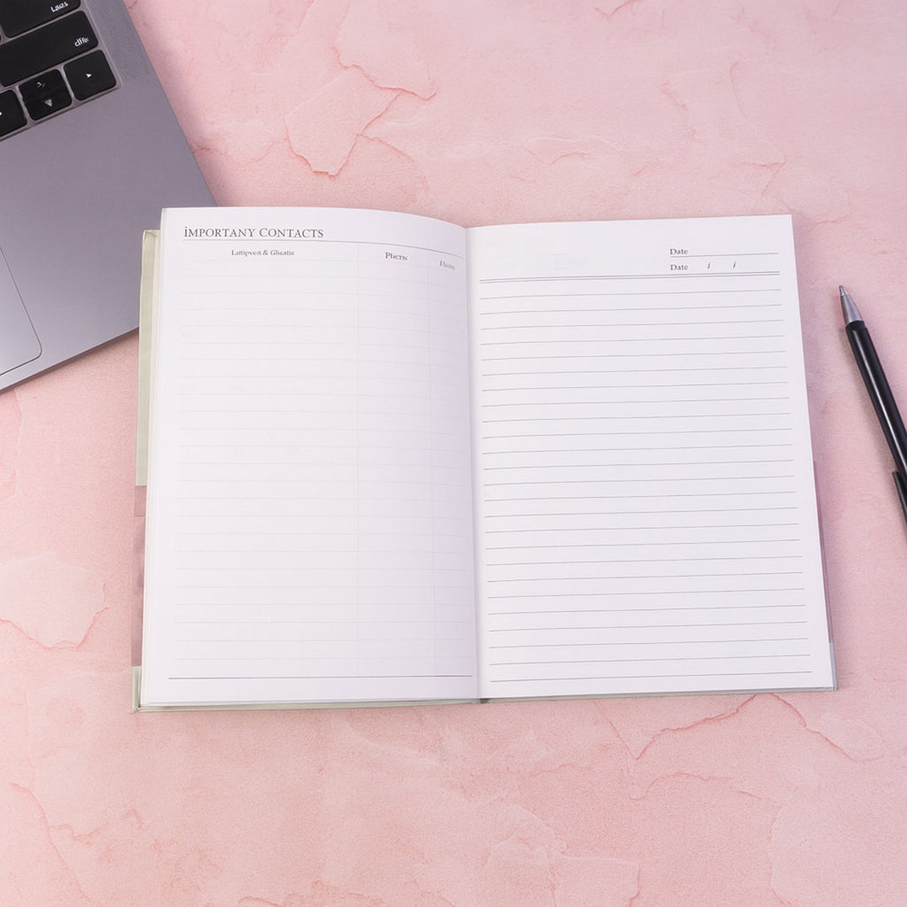 Open hardbound diary notebook prepared for writing notes