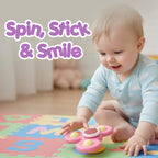 Baby using spinner toy set to develop motor skills