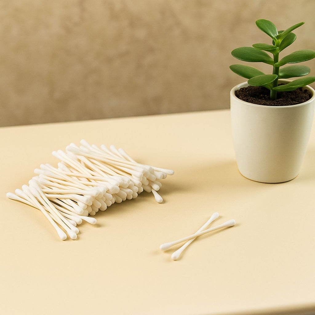 Side view of soft, tightly wound cotton tips on paper sticks.