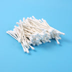 Close-up of cotton swabs highlighting paper stick stems for grooming