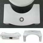 Toilet squat stool in use, highlighting its foldable design and helpful footprint guides.