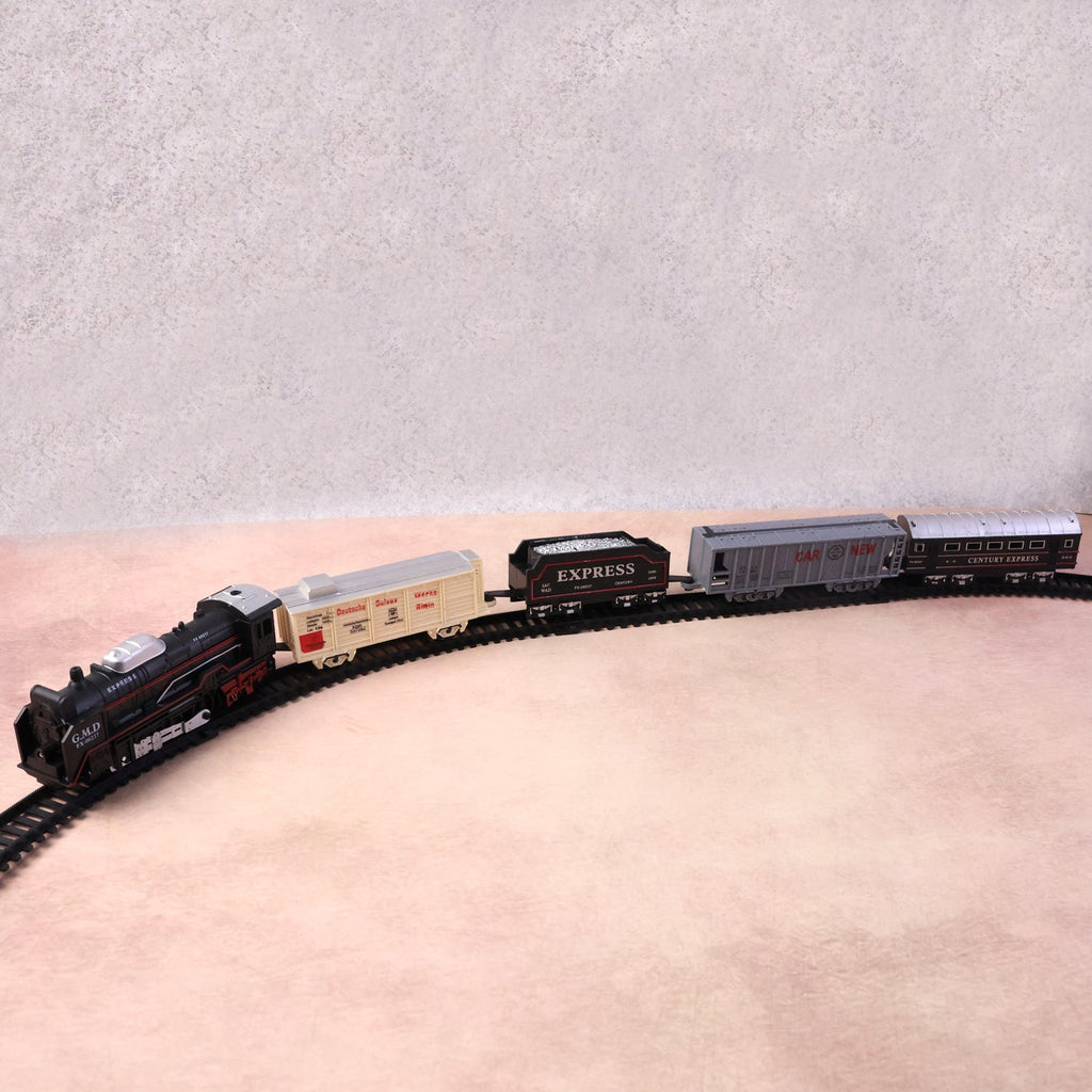 Battery powered toy train set pieces showing engine and carriages
