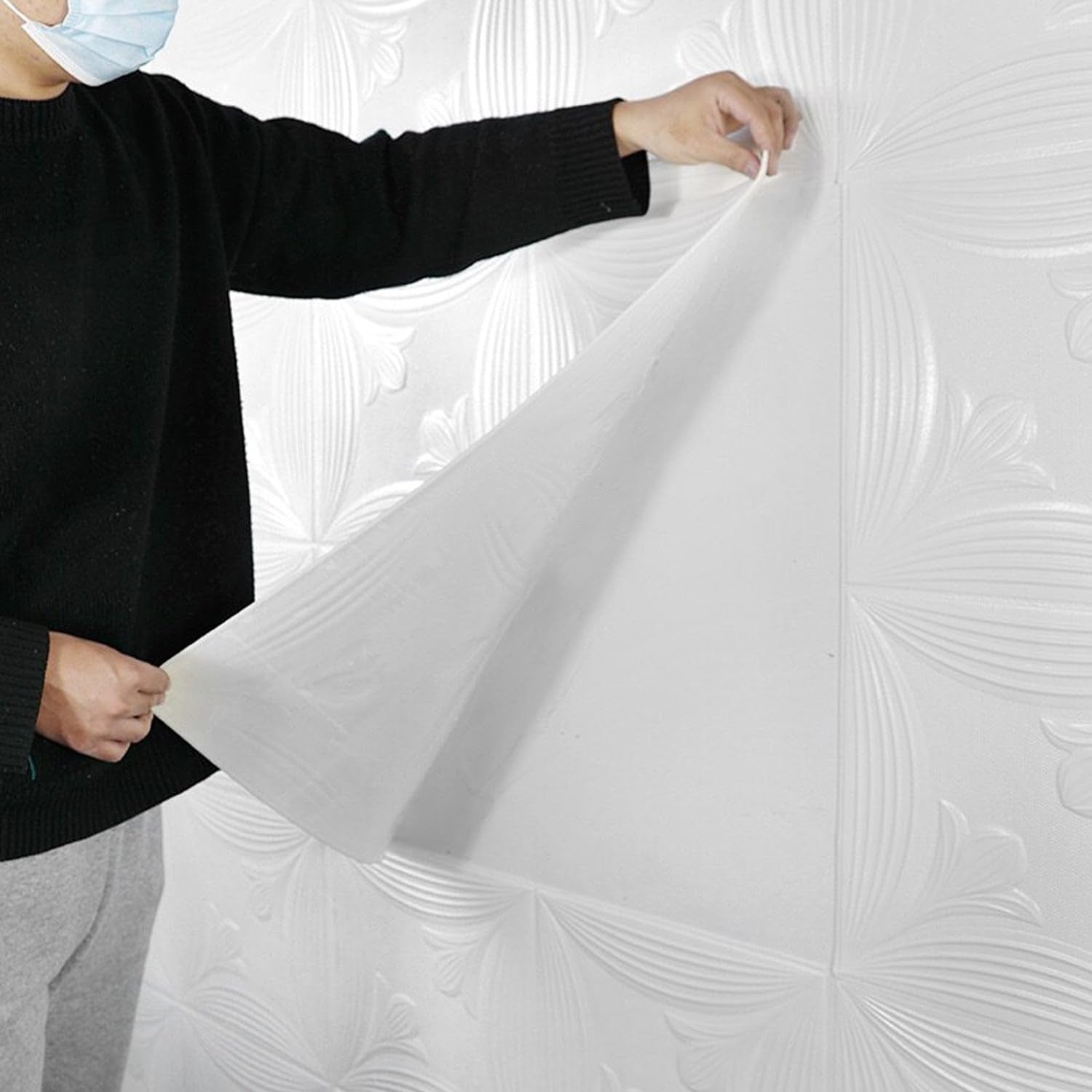 Textured foam wall tile showcasing embossed 3D pattern in white color