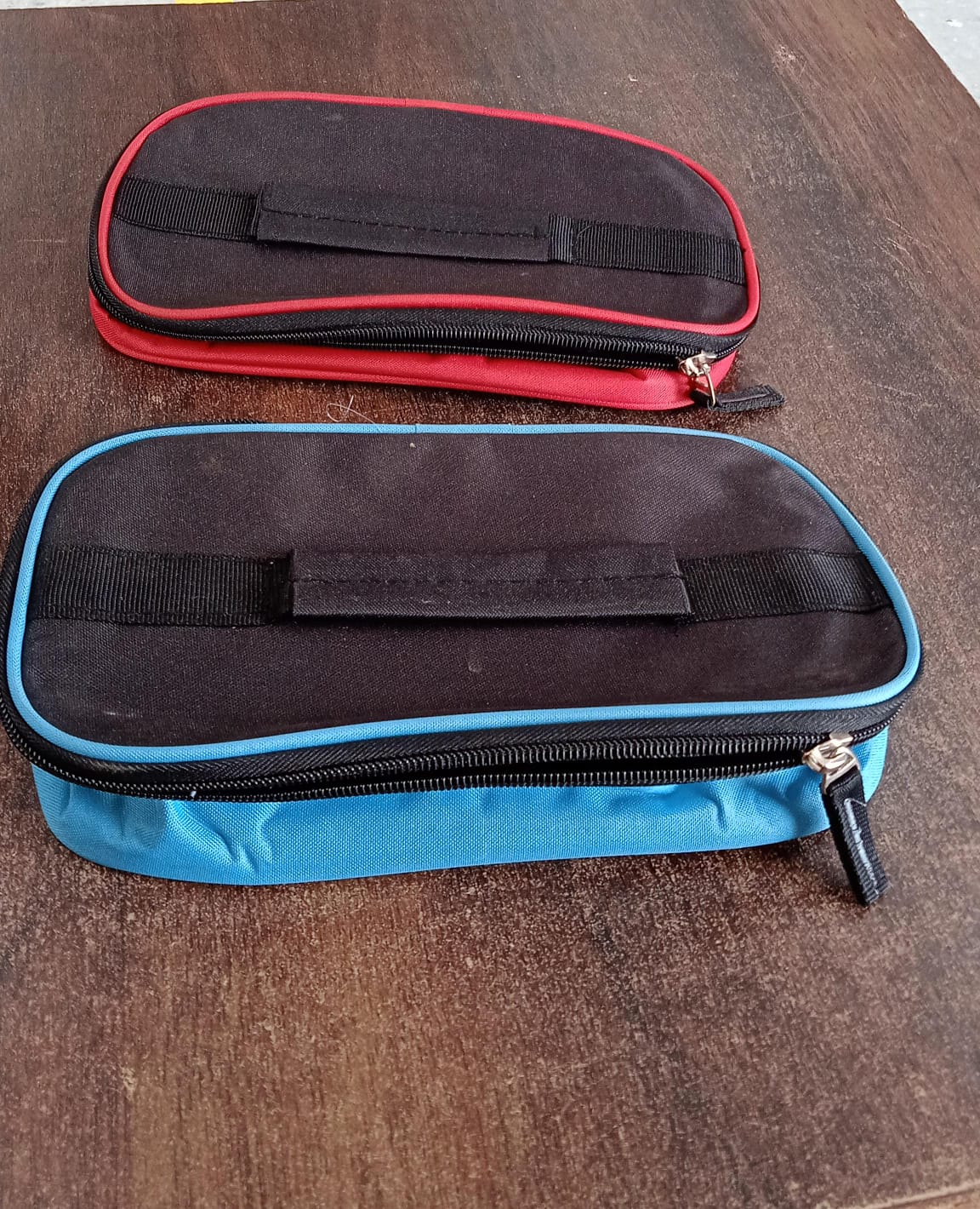 Insulated lunch bag securely carrying a tiffin box inside