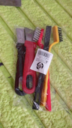 The 5-piece wire brush and scraper set laid out on a workshop surface.