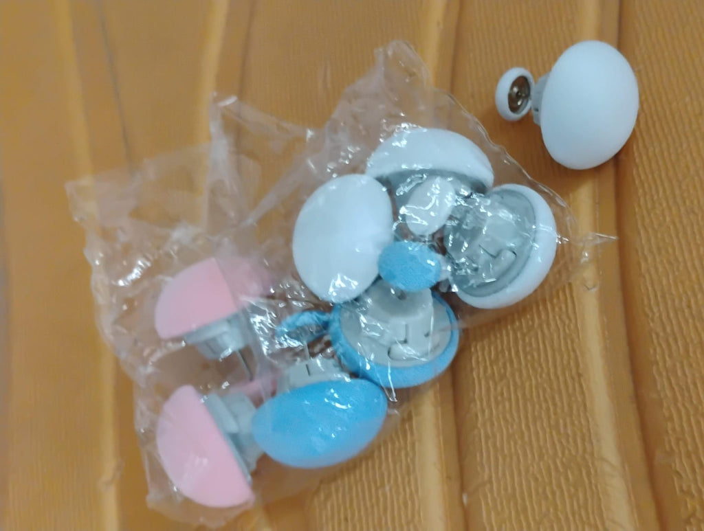 Mushroom-shaped upholstery pins easily secured on a sofa fabric