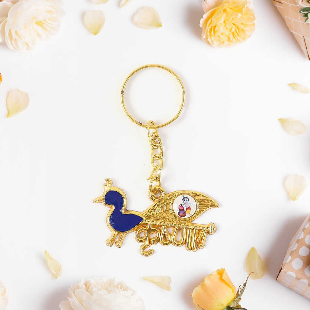 Decorative Krishna keychain featuring peacock motif with enamel detailing