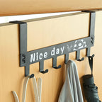 Black steel door hook rack holding bags, scarves, and coats