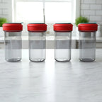 Person sprinkling spices from 4-in-1 shaker set directly onto food