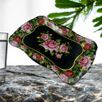 Floral stainless steel serving tray on a dining table, showcasing its aesthetic appeal.