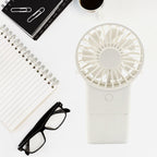 Assortment of 3-speed handheld fans in various colors: pink, blue, white, and green.