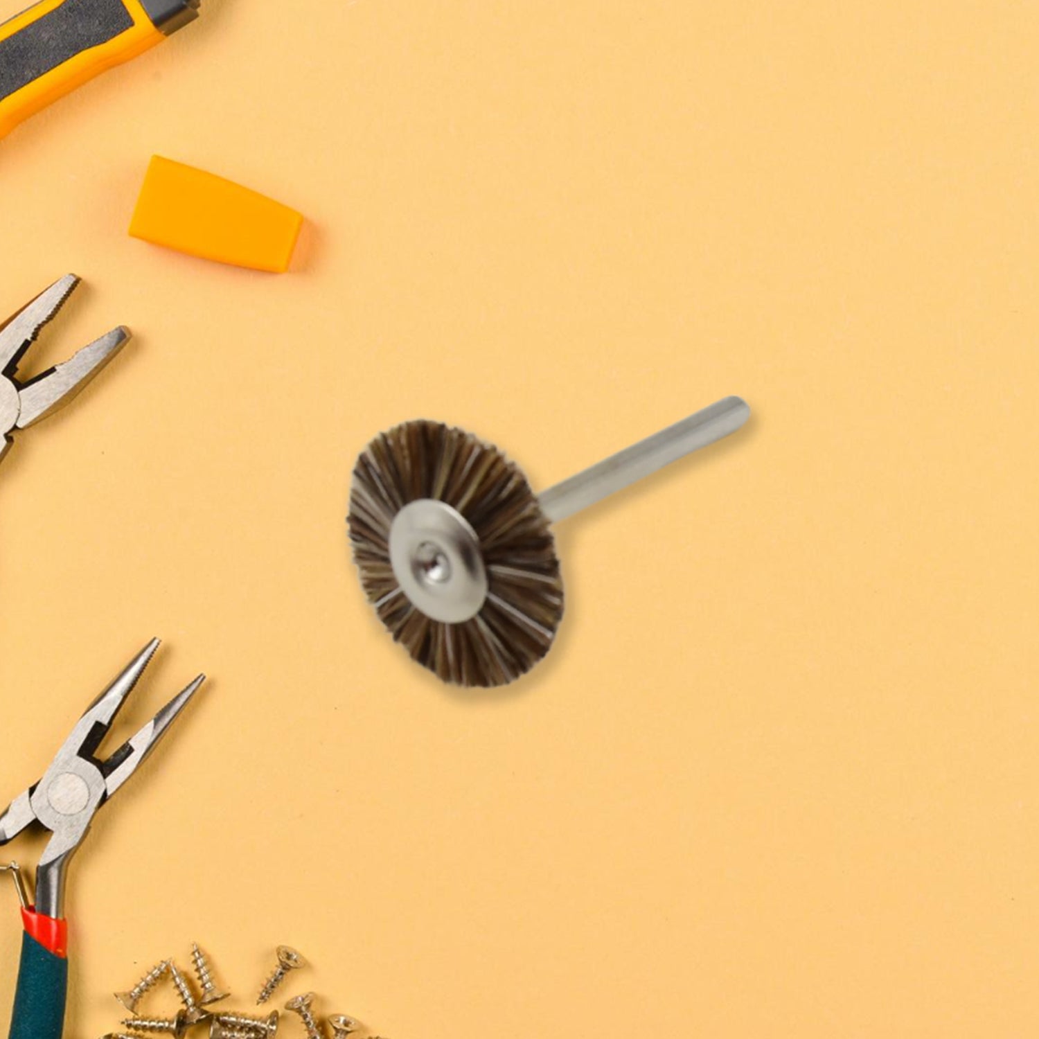 A shank-mounted brass wire brush, ideal as a drill attachment for metal grinding.