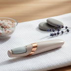 Electronic pedicure tool charging via USB, highlighting its convenient rechargeable feature.