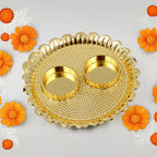 Detailed shot of the individual Kumkum bowls neatly arranged on the Puja Thali.