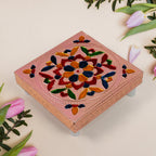 Square-shaped wooden bajot with detailed Meenakari artwork for puja rituals.