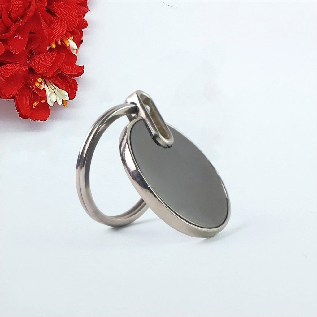 Elegant round black keychain with minimalist metal design