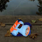 Hand holding compact rechargeable LED headlamp for portable lighting