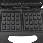 Close-up of the cool-touch handle and indicator lights on the Dabster sandwich maker.