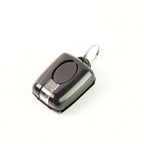 Mini LED flashlight attached to a keyring for convenient daily use