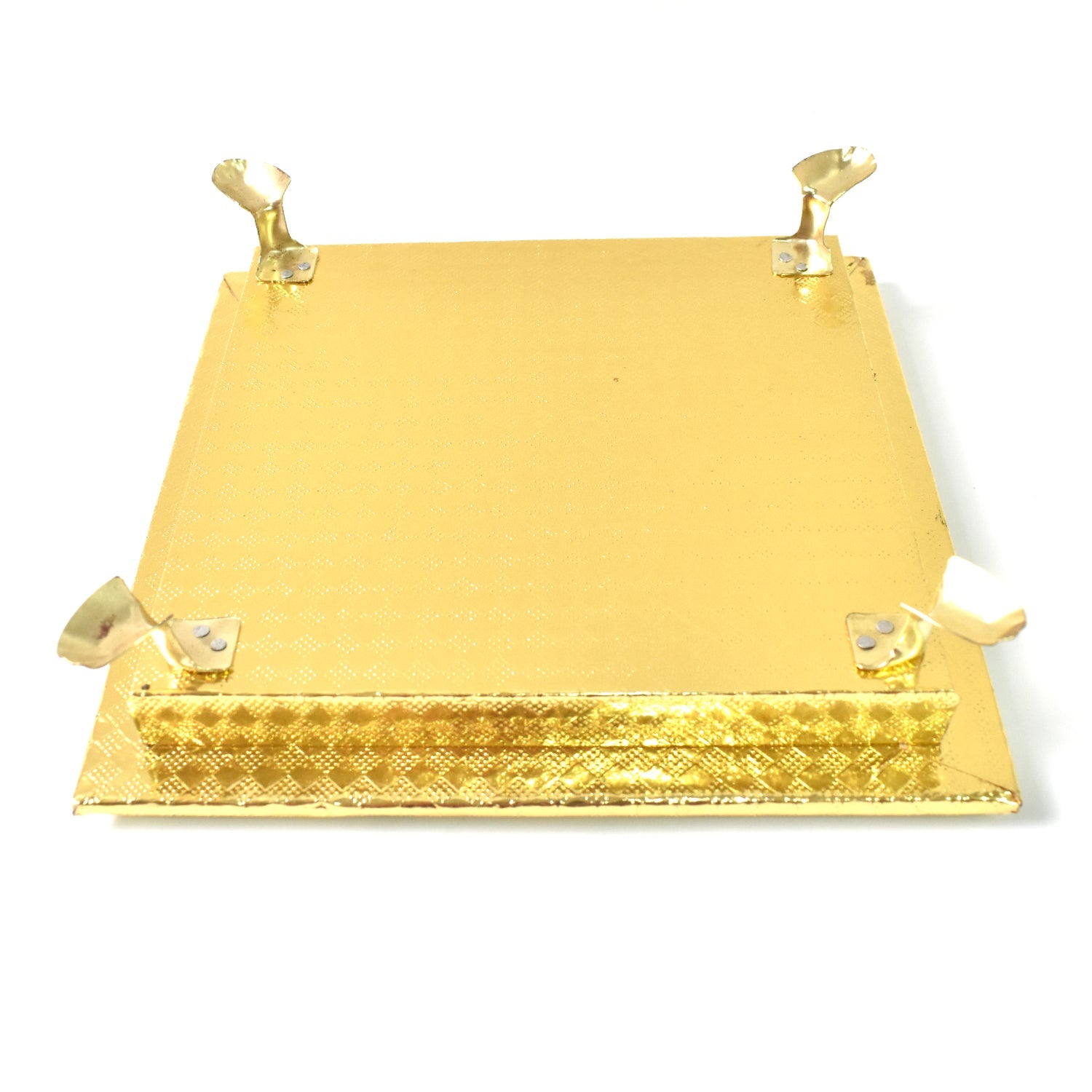 Golden Square Pooja Chowki displayed in a home temple setting.