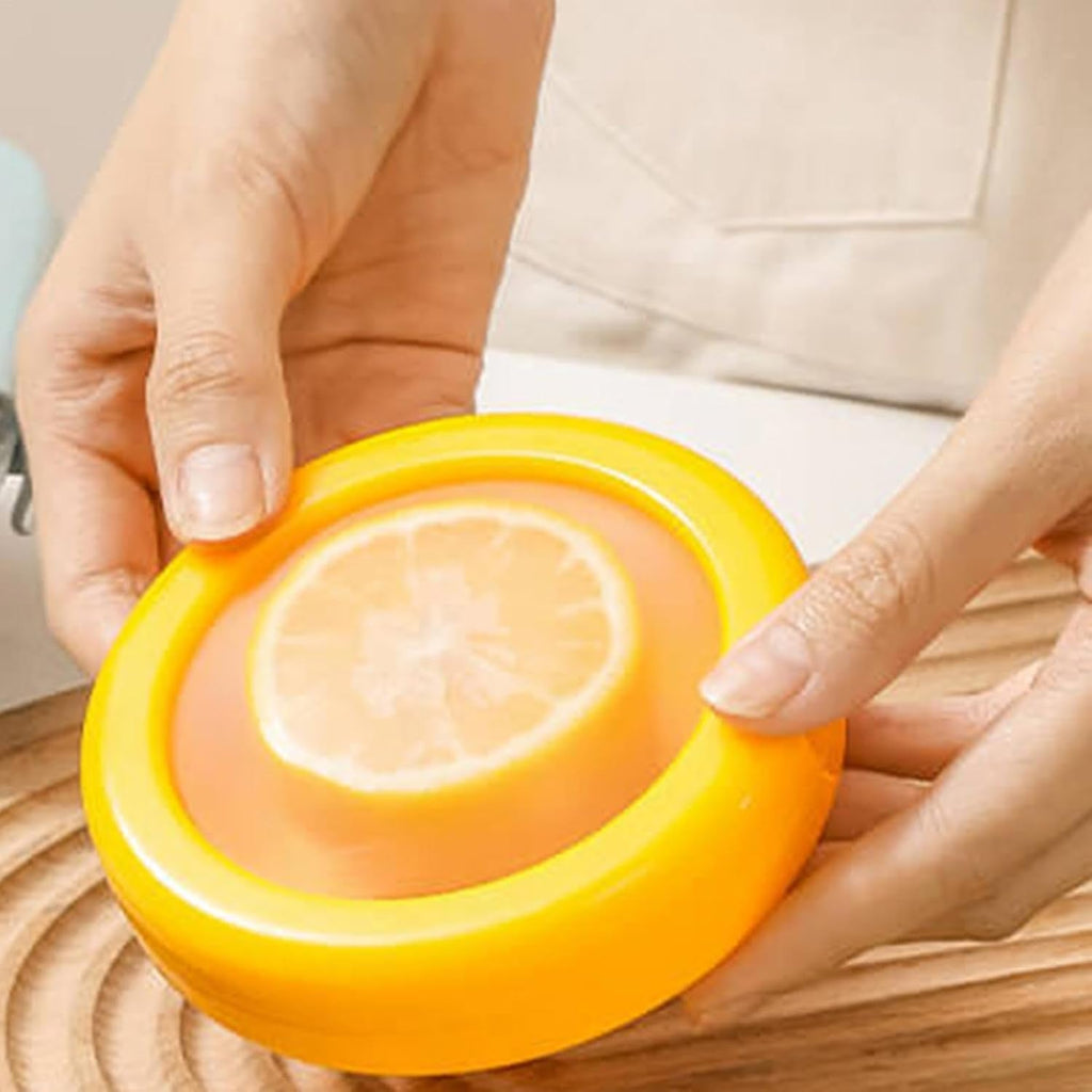 Angled view of the yellow produce keeper with its lid on, extending freshness.