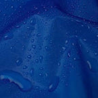 Group of boys and girls happily wearing their reusable EVA raincoats in rainy weather.