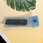 Cute cartoon-themed remote cover in a vibrant cloth design.