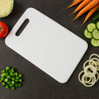 Medium plastic chopping board in kitchen setup