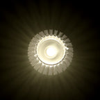 Close-up of a crystal-patterned LED flameless candle glowing warmly